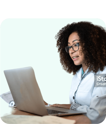 Female dentist wearing a white lab coat, curly black hair, and glasses, conducting a virtual consultation for Dentistry.One