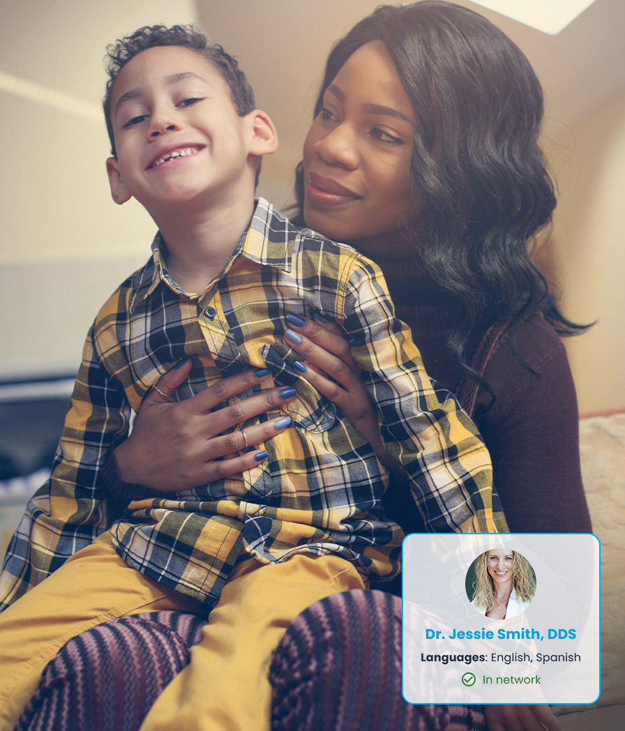 Woman holding a child, with a badge overlay mentioning Dr. Jessie Smith, DDS, a trusted dentist for personalized virtual dental care.
