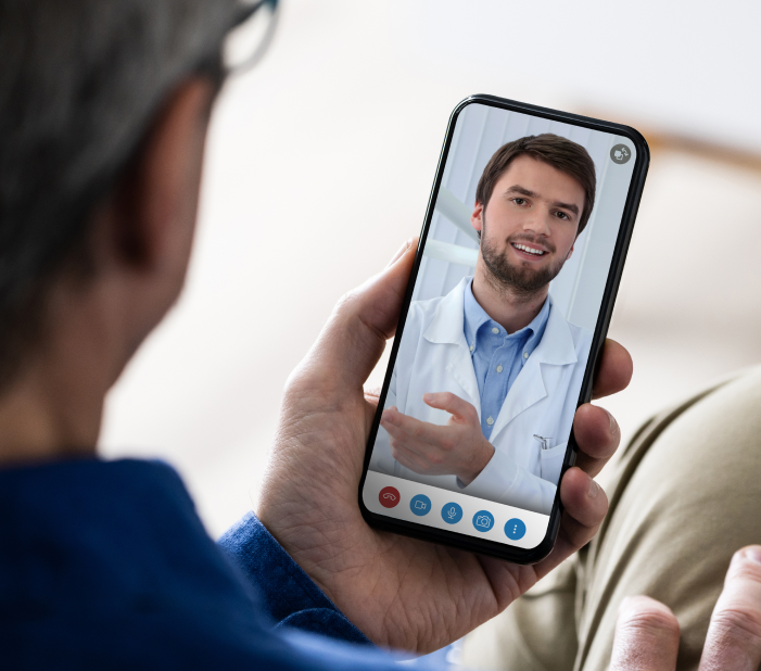 Older gentleman using his smartphone for a virtual consultation with a Dentistry.One dentist, demonstrating the ease of accessing online dental care anytime, anywhere.