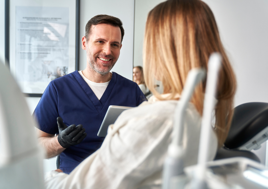 dentist talking to patient about wisdom teeth extraction