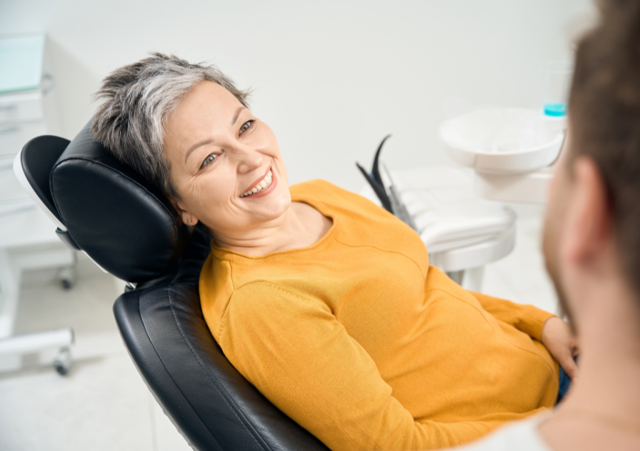 dental patient talking with dentist about dental implants