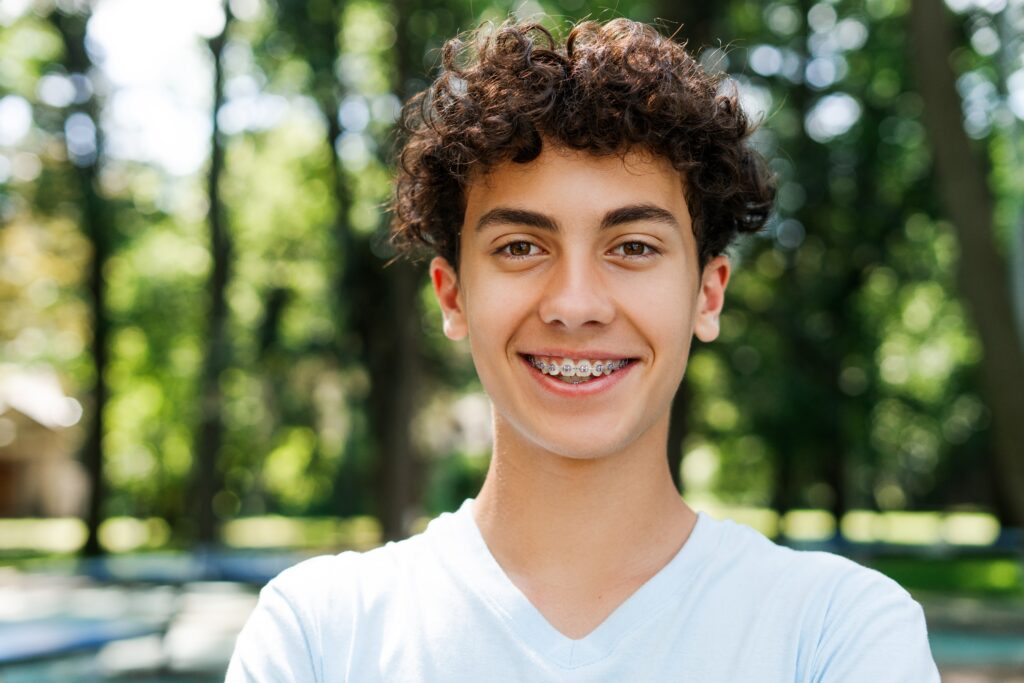 Boy with braces on teeth