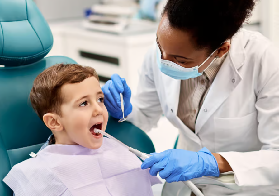 Child sitting in a dental chair getting dental care