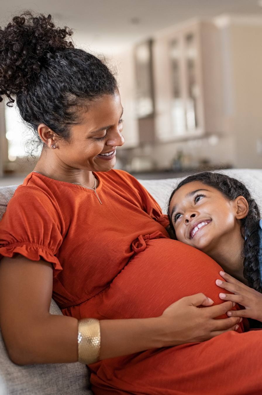 Pregnant woman in a dentist chair getting dental care.